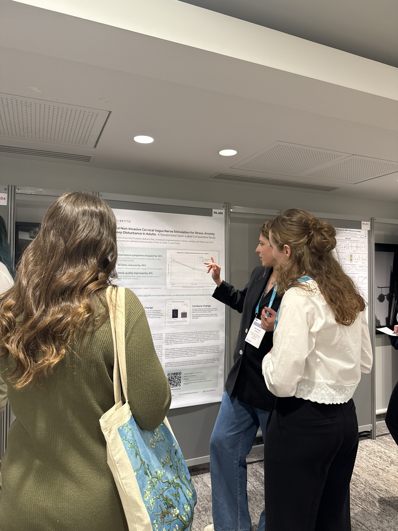 Discussing clinical study results at a scientific poster session